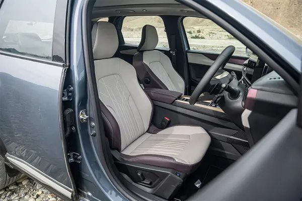 The tri-tone beige, burgundy, rose gold upholstery gives it an upmarket feel.