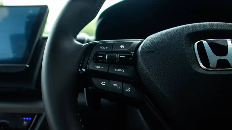 Steering-wheel controls for audio, hands-free telephony, source selection and voice recognition