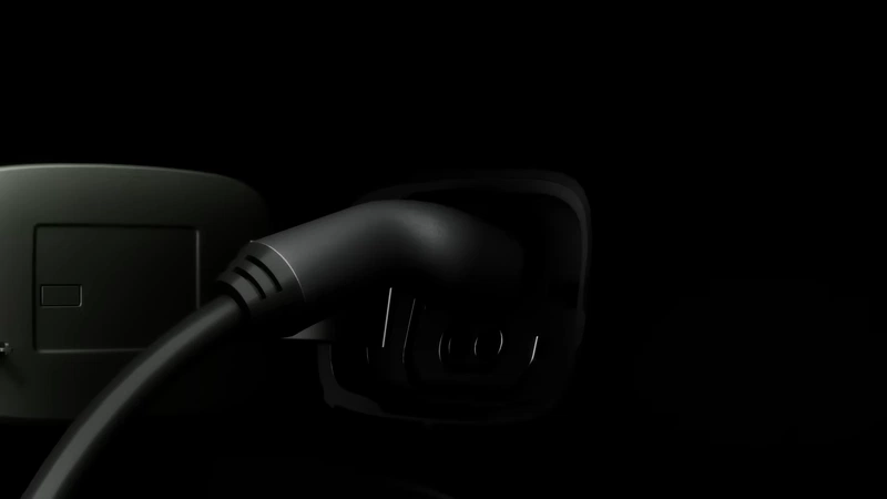 charging port with connected charger in teaser shot