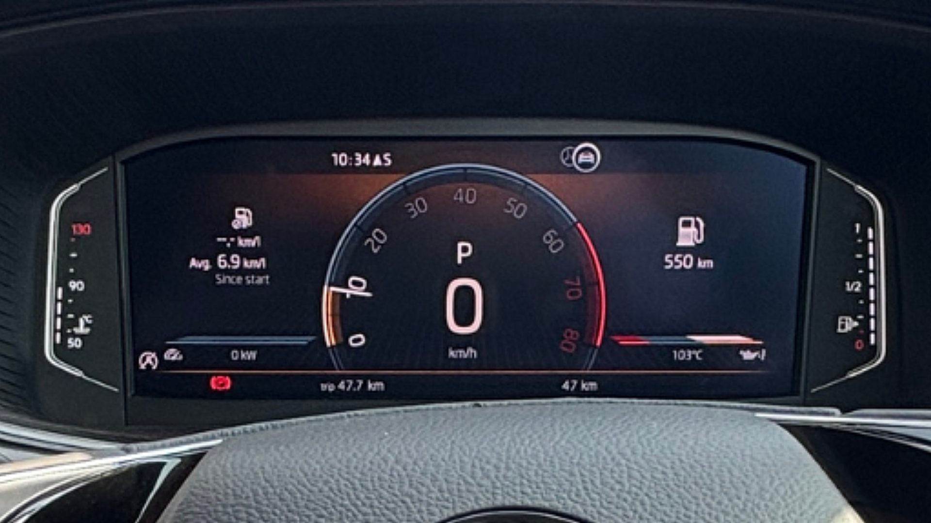 The digital instrument cluster displaying key fuel info