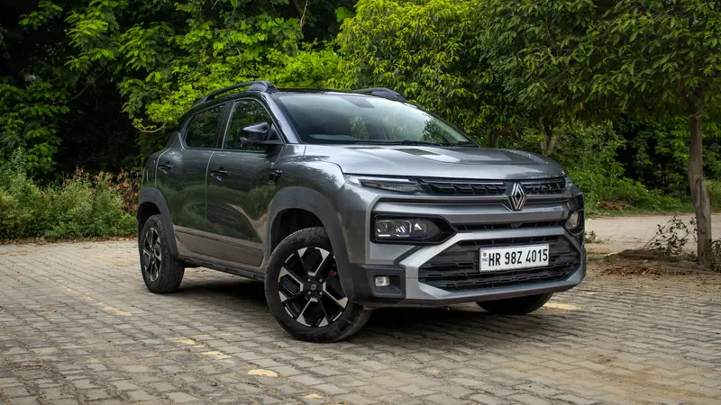 front right three-quarter view showing the grille, headlamps and alloy wheels
