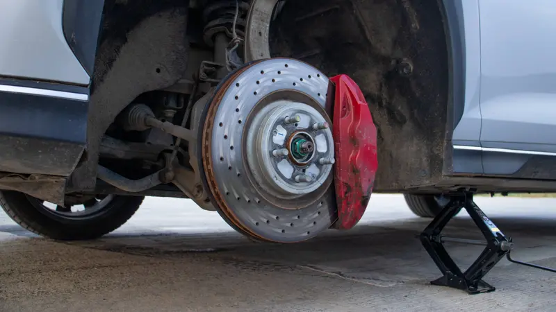 Front ventilated disc brake with red brake caliper