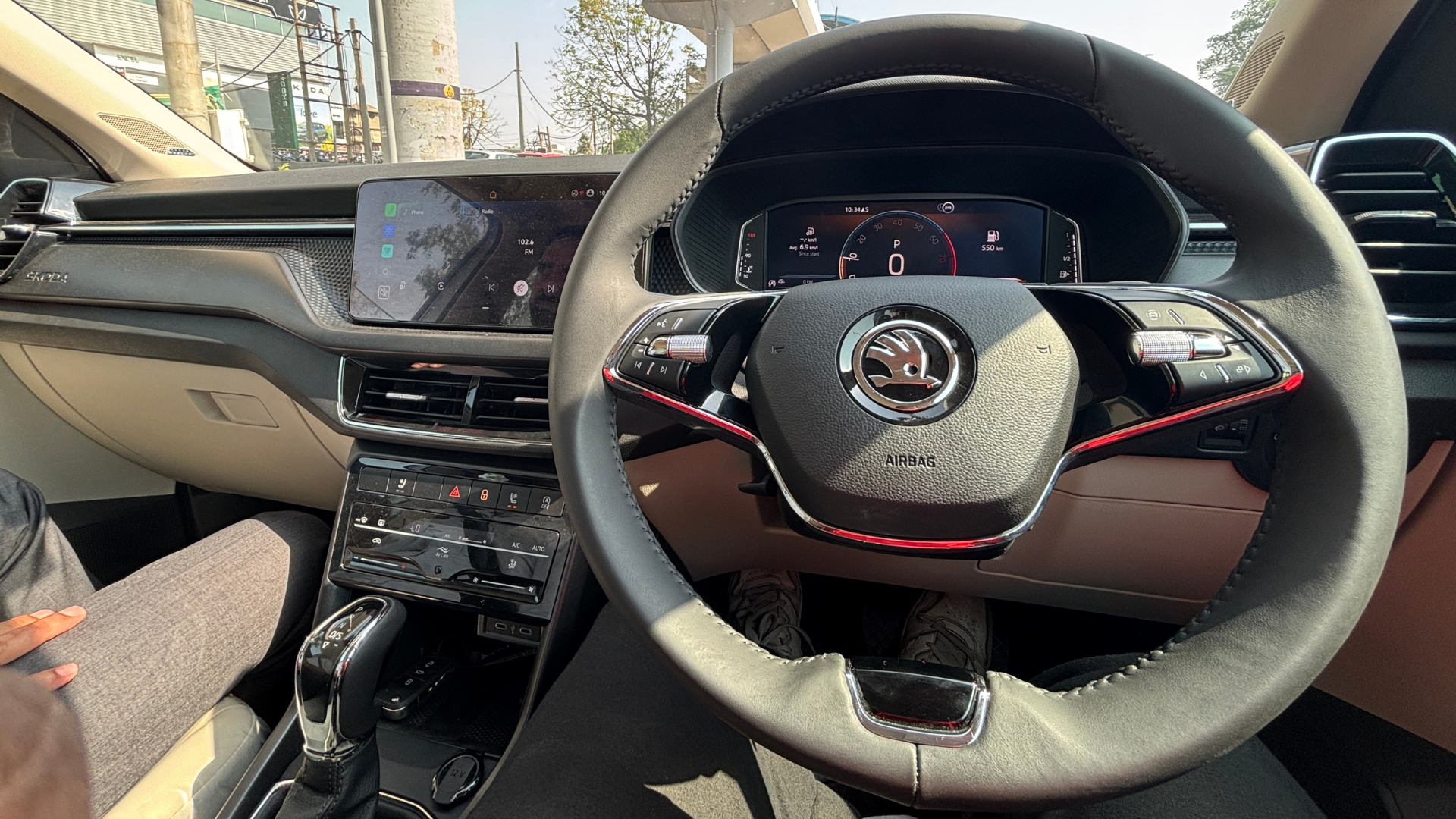 Kushaq's modern dashboard and Skoda's distinctive two-spoke steering wheel