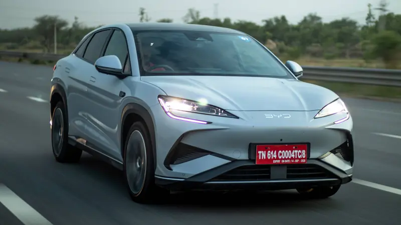 Front view on road showing LED headlights, LED daytime running lights and front bumper design