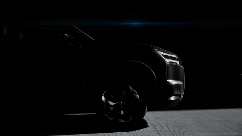 front right profile with headlight and wheel in teaser shot