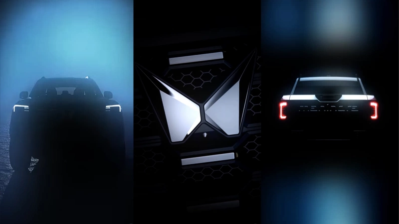 Teaser showcasing exterior front headlights, rear taillights, and Mahindra logo