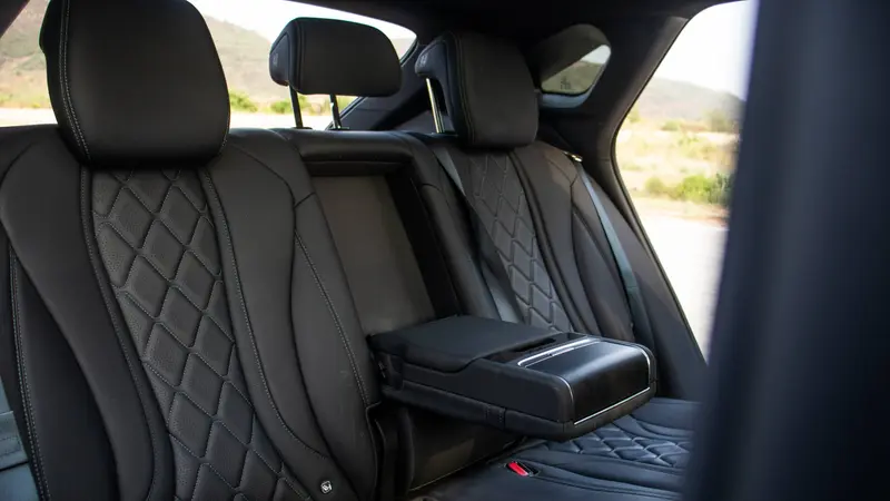 Genuine leather-wrapped rear seats and centre armrest with dual cup holders