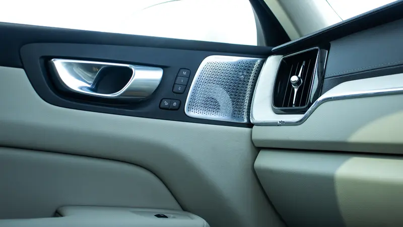 Door panel with speaker and air vent
