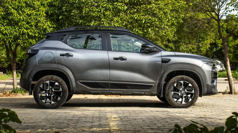side profile with roof bars and alloy wheels