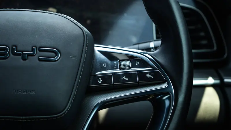 Genuine leather-wrapped steering wheel with phone, voice assistant and audio controls