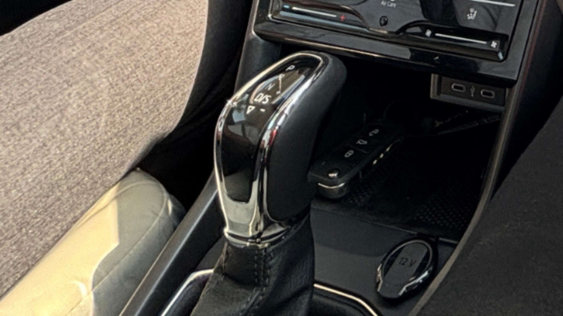 A close-up of the automatic transmission gear selector nestled cleanly in the center console