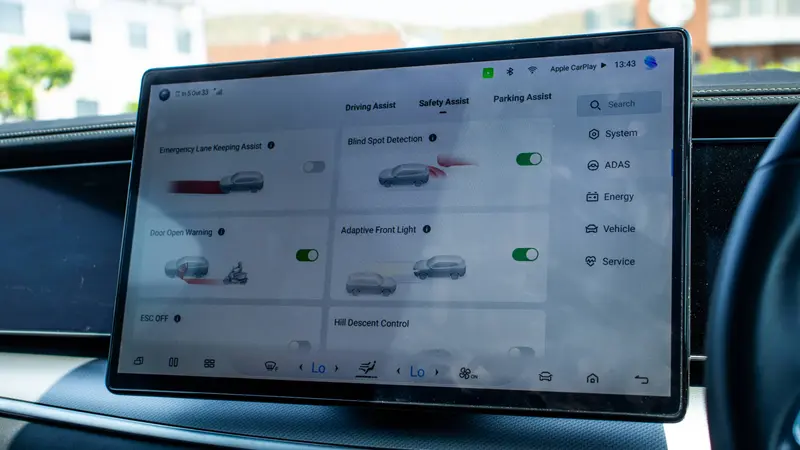 15.6-inch (39.6 cm) intelligent rotating touchscreen display showing driving assistance settings