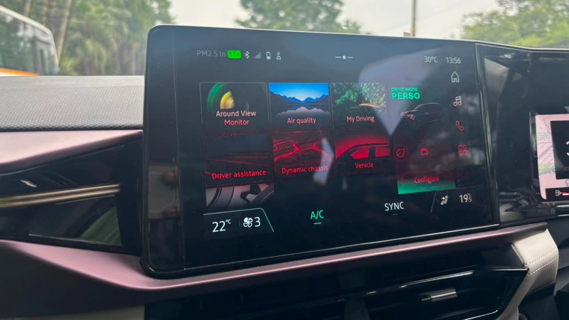 touchscreen displaying vehicle settings and driver assistance menus