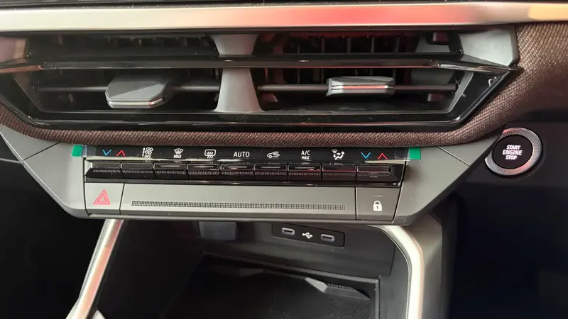 Adventure dashboard air vents, climate controls, USB ports and engine start-stop button closeup