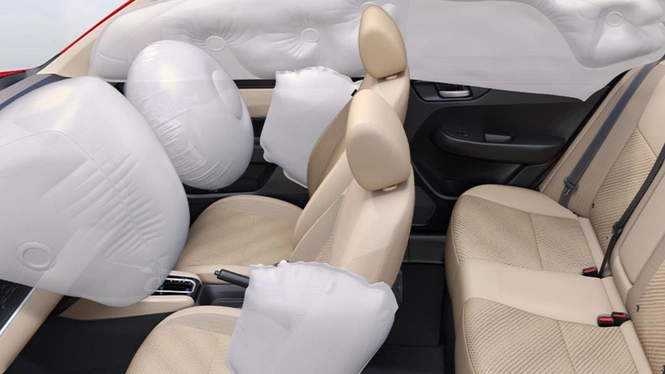 Honda Amaze's deployment of driver, passenger, side, and curtain airbags around the beige interior seats